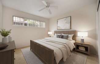 A bedroom with a bed, nightstand, and a ceiling fan.