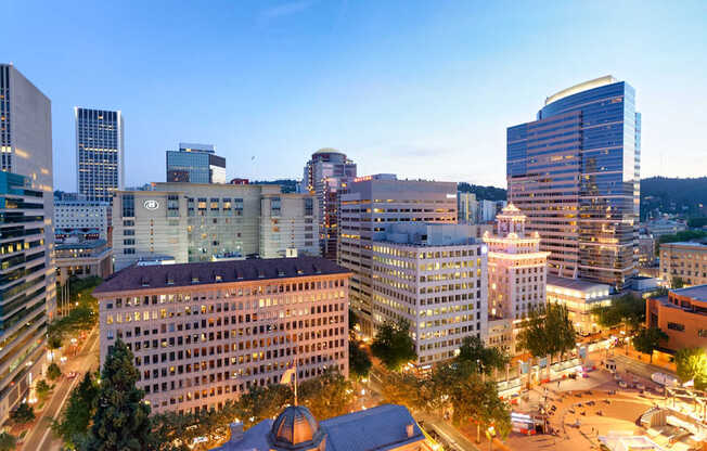 A cityscape with buildings and a dome structure.
