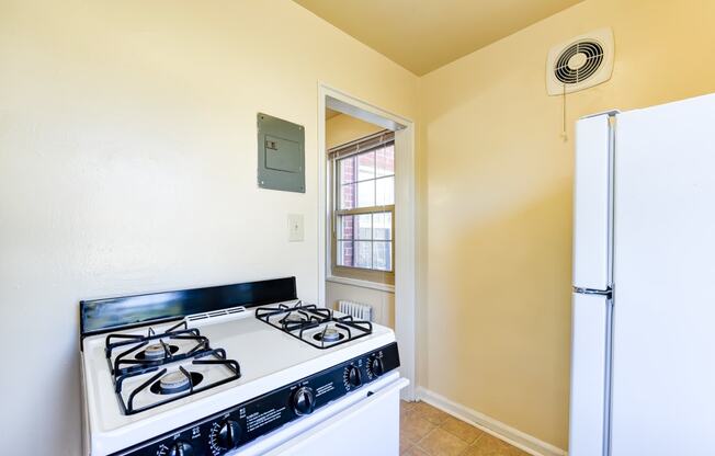 kitchen with white appliances at richman apartments in washington dc