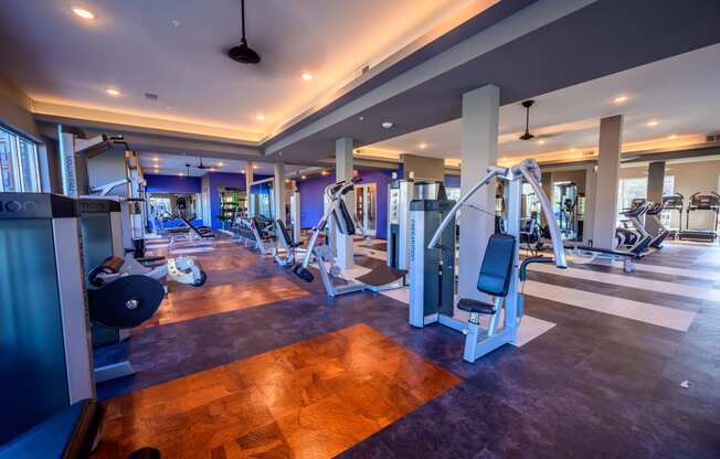 Harmony Luxury Apartments fitness room with equipment Apartment near Garland,  TX