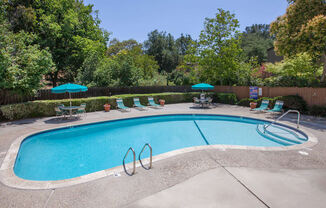 Swimming Pool Area With Shaded Chairs at The Glens, San Jose, 95125