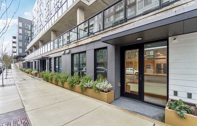 A building with a balcony and a glass door.