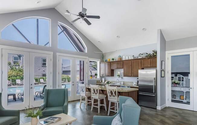 A clubhouse kitchen with dining and sitting areas at The Landing Apartments and Townhomes, Oregon, 97045