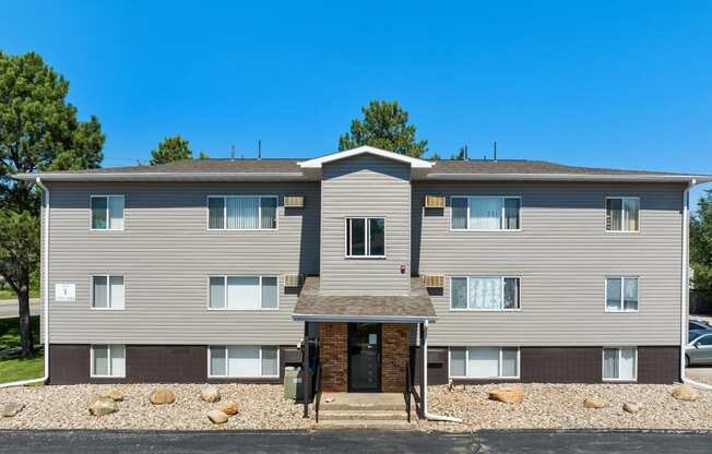 an image of a house with a blue sky in the background