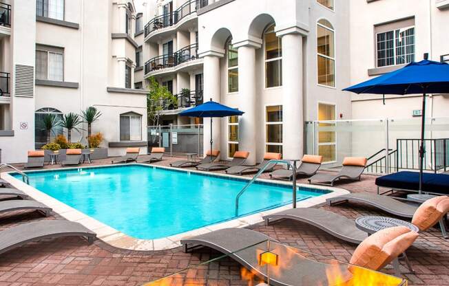 Swimming pool and firepit with lounge seating