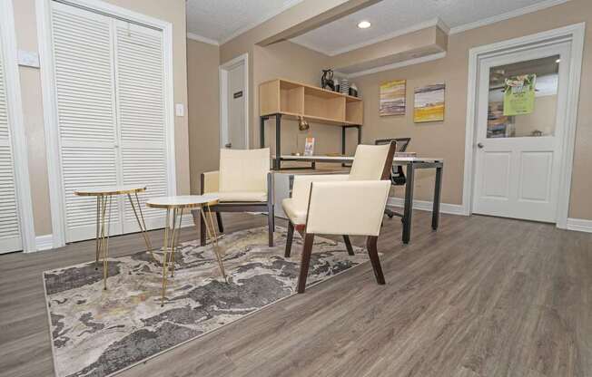 A leasing office with a rug and chairs  at The Creole Apartments in Shreveport, LA