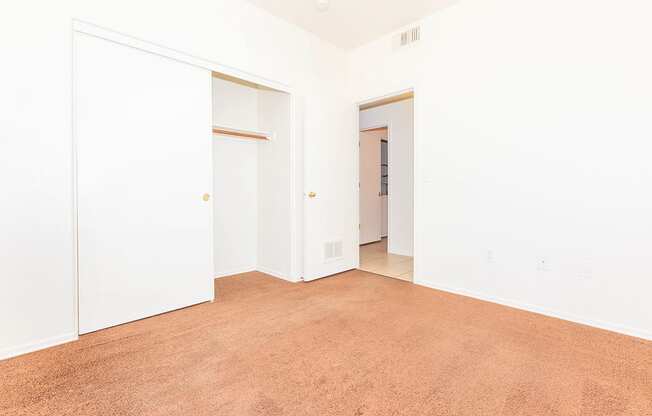 Room with Brown Carpeted Floor at San Martin Apartments, Glendale, Arizona