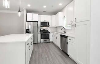 BRAND NEW SUITES - quartz countertops, stainless steel appliances, large islands and matte black finishes and hardware