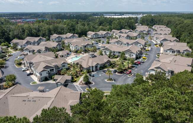 an aerial view of a neighborhood with houses and trees