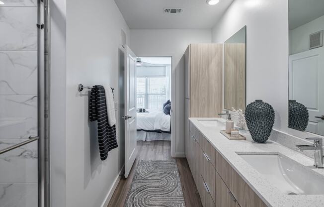 a bathroom with a sink and a mirror at Altis Grand Suncoast, Florida