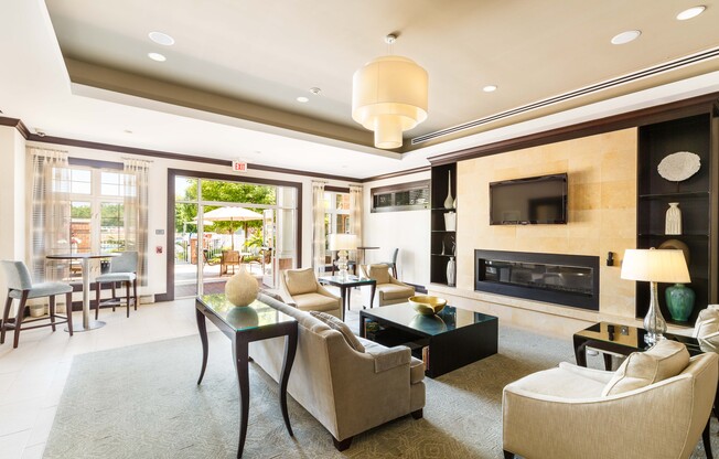 A living room with a fireplace and a television.
