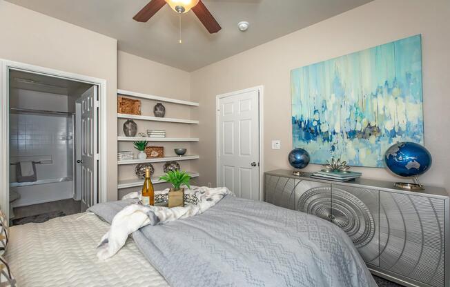 a bedroom with a bed in a room