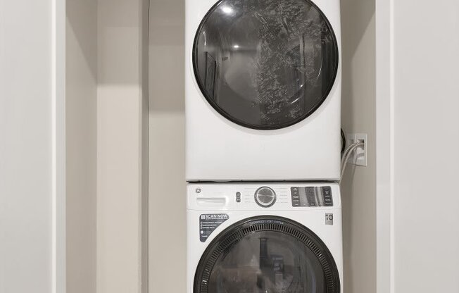 a washer and dryer in a small laundry room