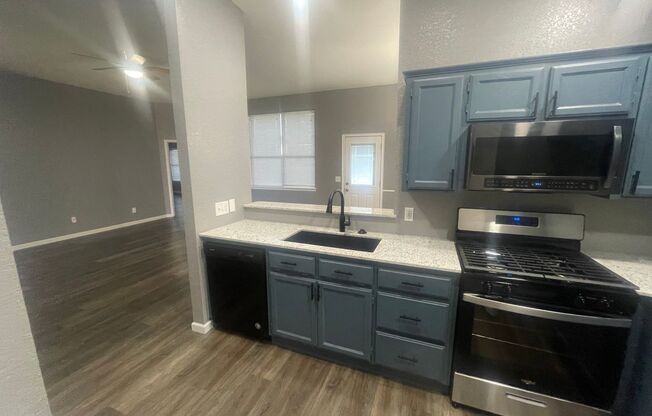 Completely remodeled 4 bedroom in Moore ready for move in ! New countertops and appliances, luxury vinyl flooring, new fixtures, small fenced yard with storm shelter, storage shed and a view!!