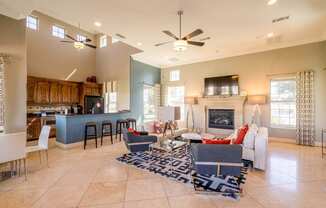 the living room is open to the kitchen and dining area