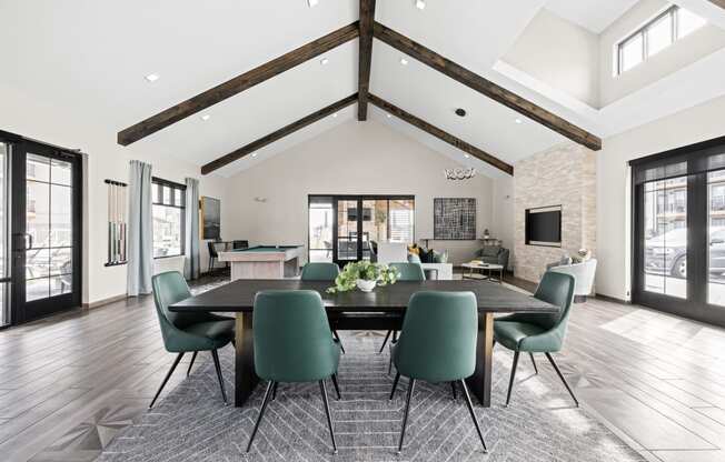 a large dining room with a large table and chairs