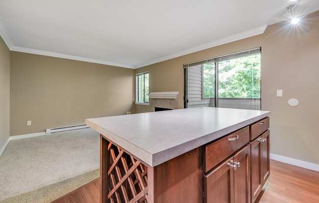 Wine Rack and Island Facing Living Room at Whispering Brook Apartments, Washington,98198