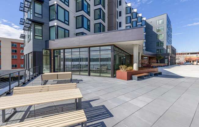 public walking area with wooden bench seating at Marina Square, Bremerton, 98337
