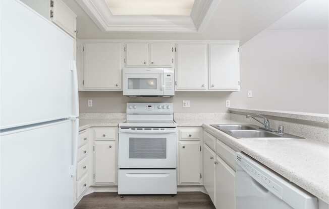 renovated kitchen with white cabinets