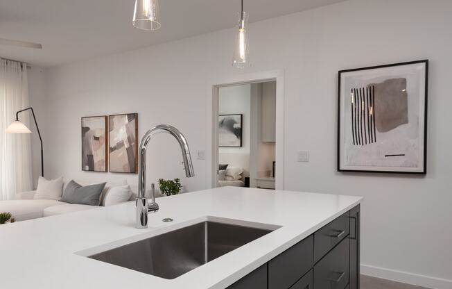 a clean kitchen with a sink and a counter top