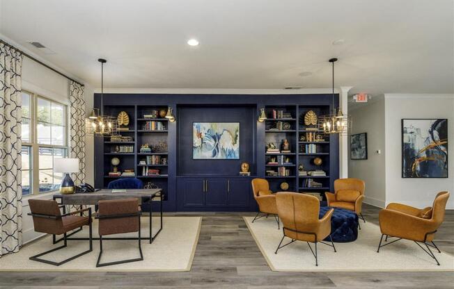 a living room with a table and chairs