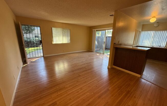 Spacious 2bd First Floor Condo W/Private Patio, Attached Garage, & Private Laundry Room