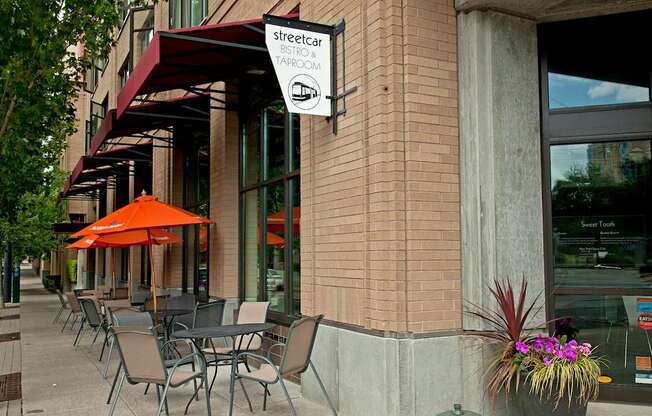 A sign for a bistro and tasting room hangs on a building.