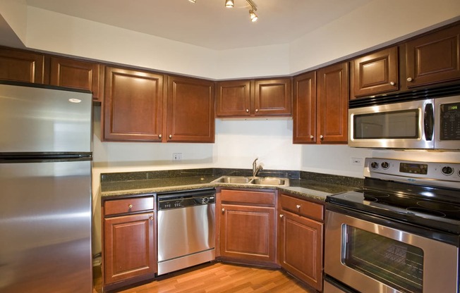 Kitchen with cabinets at Versailles on the Lakes Schaumburg, Schaumburg, IL