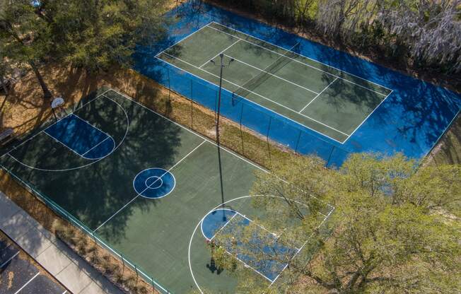 an aerial view of two basketball courts on a tennis court