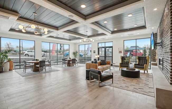 A spacious living room with a high ceiling and large windows.