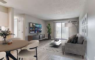 a living room and dining room with a couch and a table