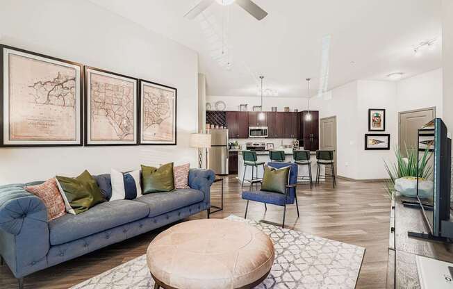 A living room with a blue couch and a coffee table.