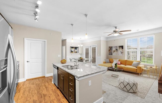 a living room with a kitchen and a couch