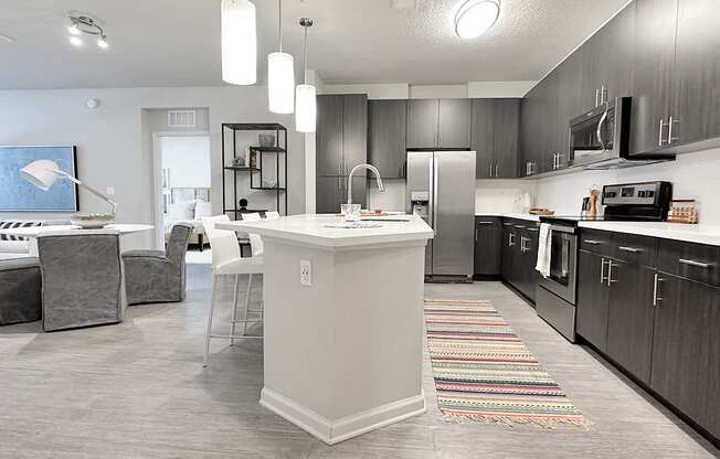 Open concept floor plans with fireplaces and large islands with bar seating