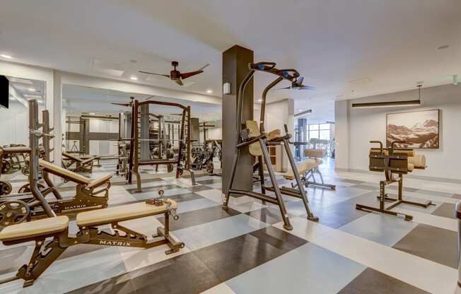 a room filled with lots of different types of exercise equipment