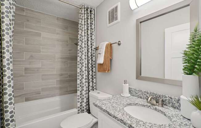 Modern bathroom with large vanity and contemporary finishes