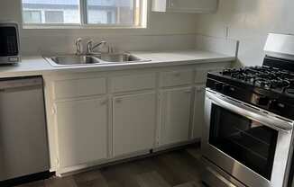 Kitchen with Stainless Steel Appliances and White Cabinets