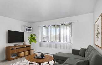 A garden style living room with a large windoiw at Glen Oaks Apartments, Michigan, 49442