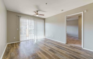 living room with vinyl wood flooring and ceiling fan at at Cypress Villas Apartments