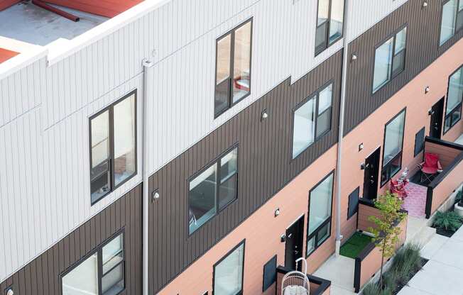 a view of the side of a building with windows and a courtyard