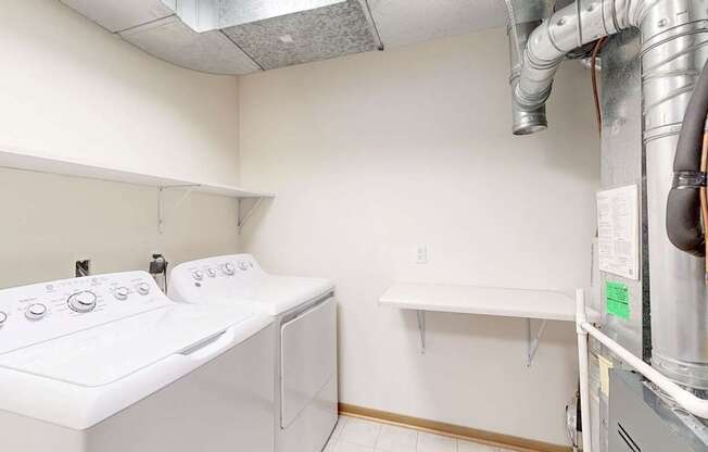 A laundry room with a washer and dryer.