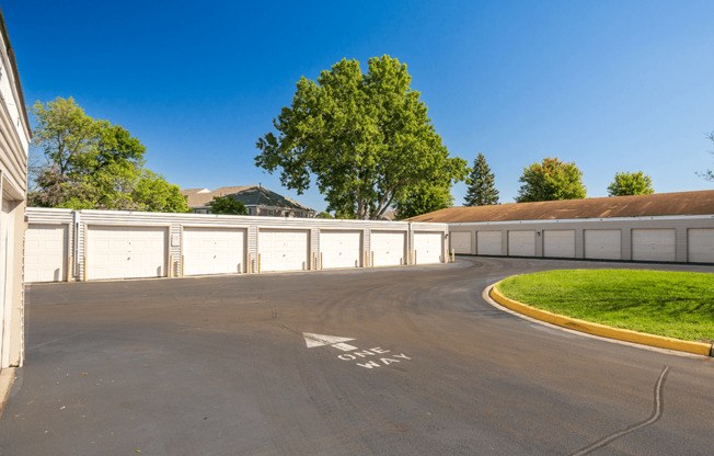 A parking lot with a white arrow on the pavement.