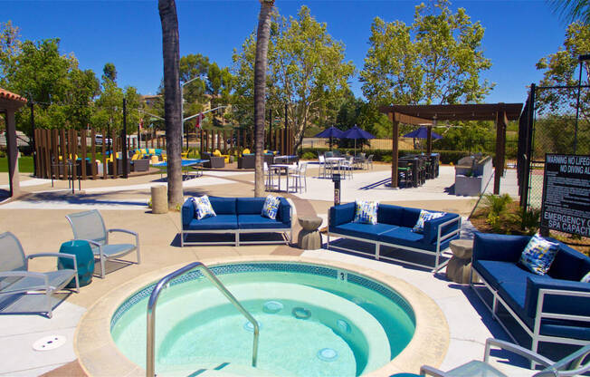 Apartments in Temecula, CA - Vista Promenade Sparkling Swimming Pool Surrounded By Lush Landscaping and Lounge Seating