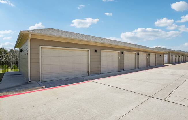 A long row of garage doors are closed.