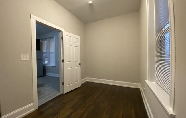 Bedroom with hardwood floors