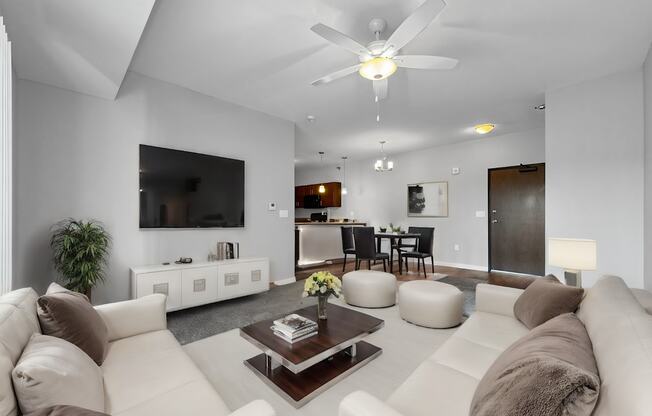 a white living room with couches and a coffee table