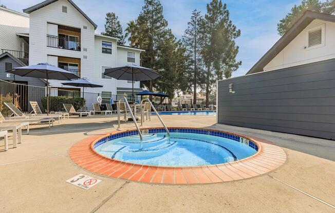 a house with a pool in front of a building