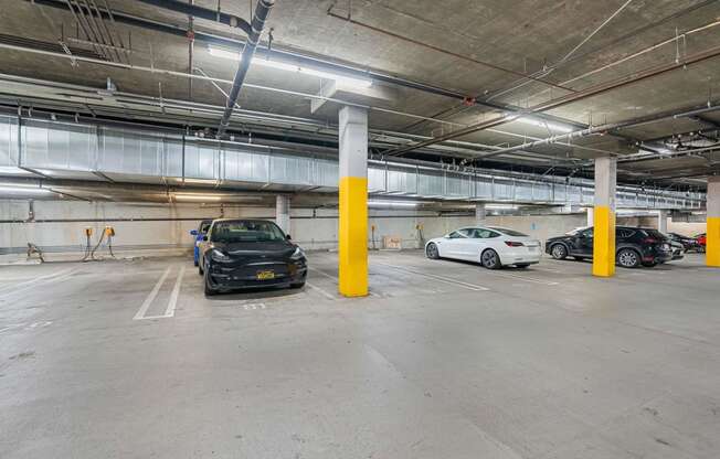 parking spaces in a parking garage with cars