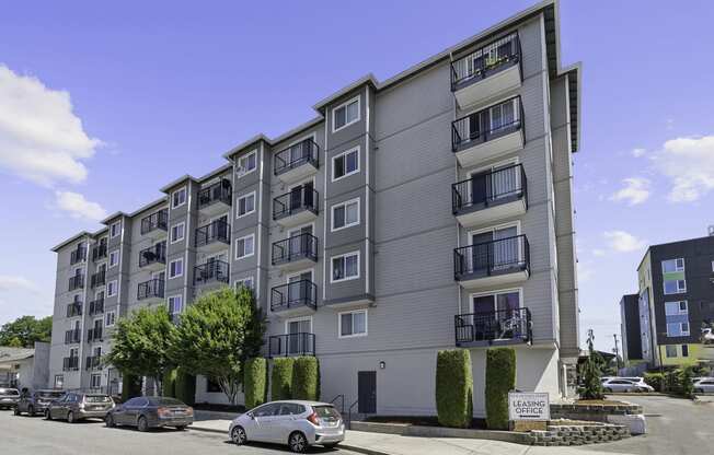 a picture of building exterior with cars parked in front of it at King Arthurs Court, Washington