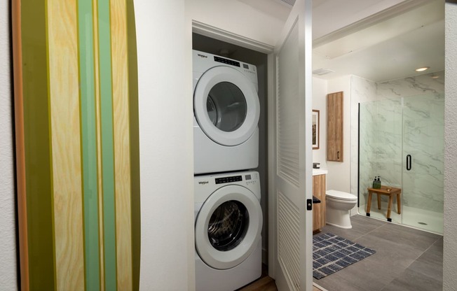 a front loading washer and dryer in a laundry room